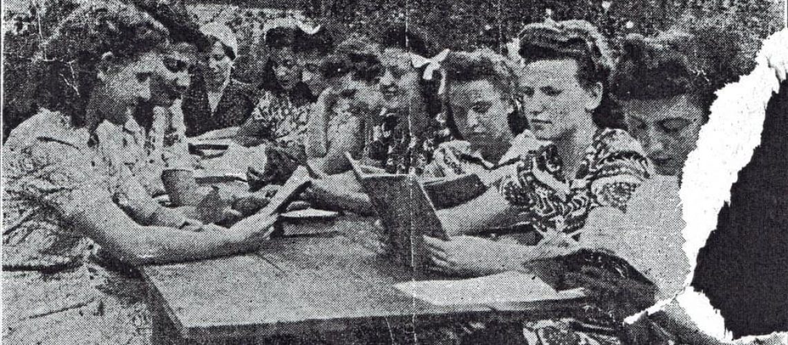 The original, unedited photo of a cluster of Bais Yaakov girls studying around a picnic table (ca. 1940).